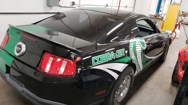 Black Cobra Jet Mustang with green Cobra Jet graphics