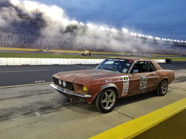 Rustang, a patina 1960s Mustang, launching on a drag strip with tire smoke behind