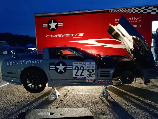 VettJett, the number 22 Laps of Honor Corvette, on a ramp beside a Corvette transporter
